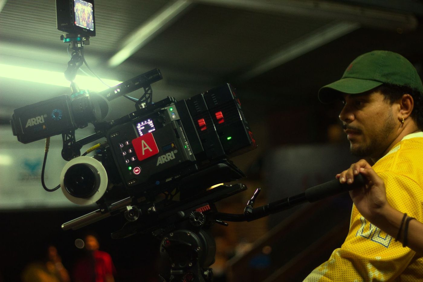 Camera operator with a cinema camera at night